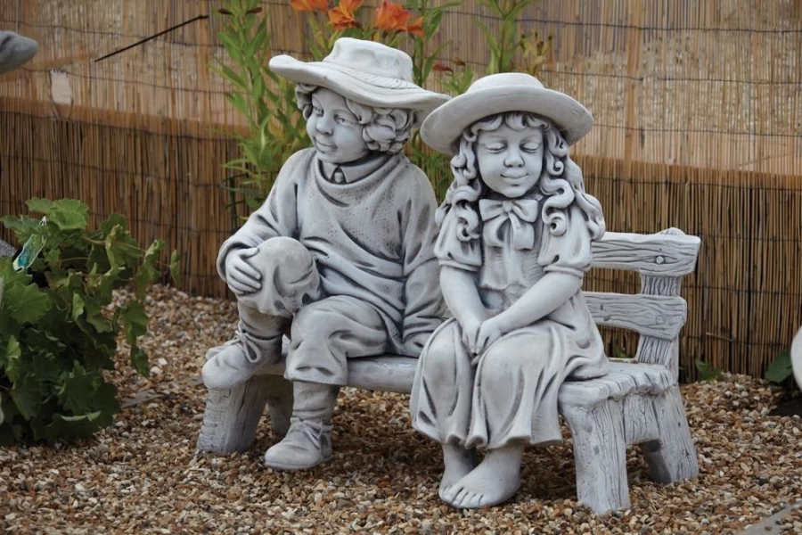 "Charming Boy and Girl Sitting on Bench Stone Garden Statue – STATUES & SCULPTURES"
